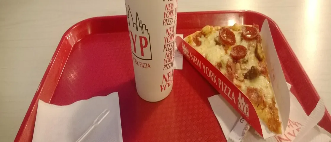 Classic crispy artisan New York cheese pizza slice on paper plate at Scarrs Pizza on Orchard Street Lower East Side